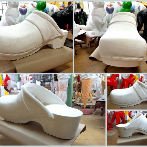 A series of images showing a large, white clog sculpture in a workshop filled with other colorful sculptures like animals and ice cream cones.