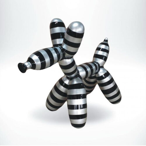 Sculpture of a balloon dog with black and silver horizontal stripes.