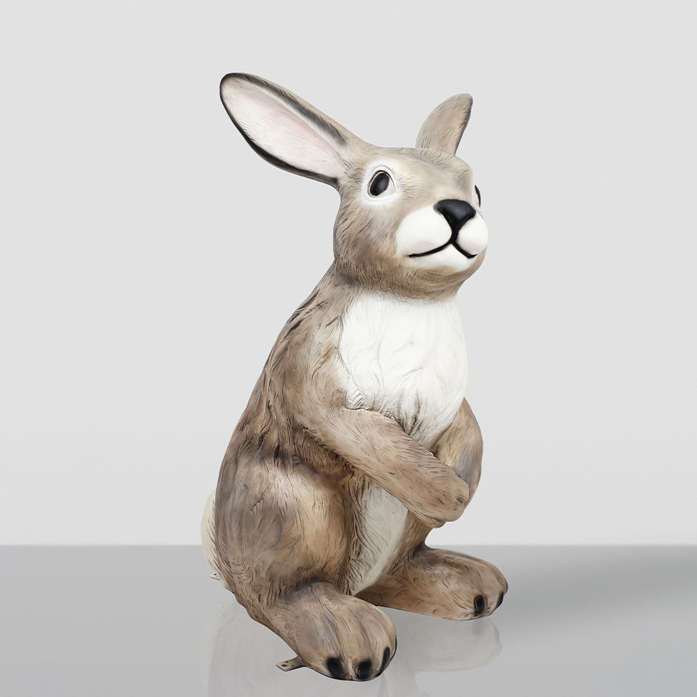 Large Rabbit Fiberglass Statue - Single Color 2 Realistic brown and white rabbit figurine sitting upright on a reflective surface against a plain light gray background.