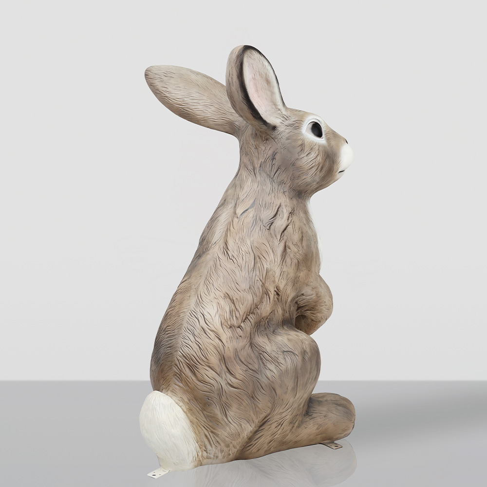 Large Rabbit Fiberglass Statue - Single Color 3 Brown rabbit figurine with textured fur and a white tail, sitting upright on a reflective surface against a plain background.