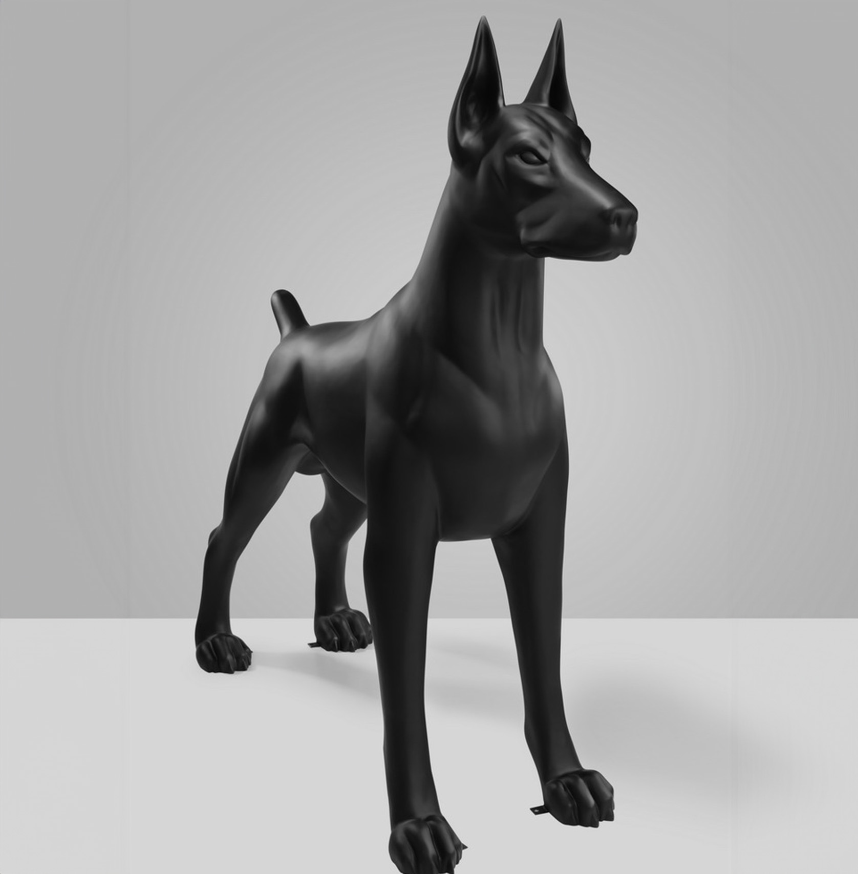 Large Doberman Fiberman Figure - Single Color Edition 2 A black, stylized, Doberman Pinscher statue with a sleek, modern design.