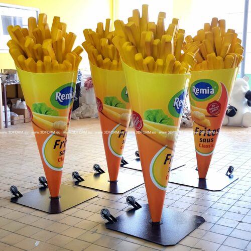 Large 3D models of French fries in conical containers labeled 
