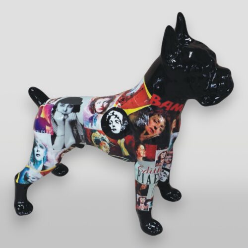 Statue of a dog covered in colorful collage images of various people.