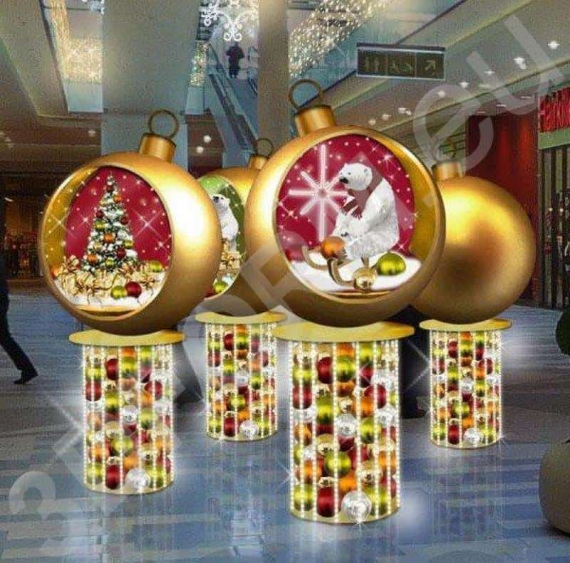 oryg_064490685_1129949550544944_1465385417682452480_o Large Christmas ornament decorations in a shopping mall featuring Christmas trees and polar bears inside.