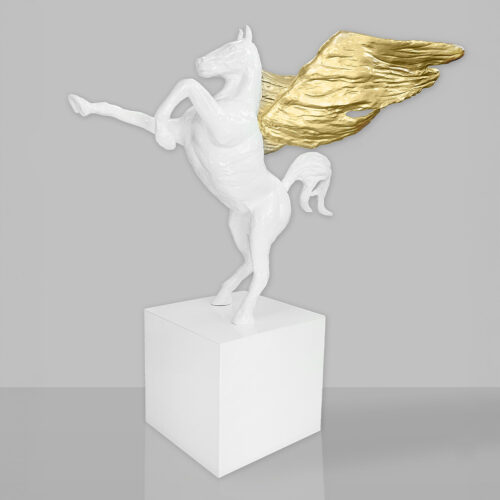 White statue of a rearing winged horse with gold wings on a white pedestal.