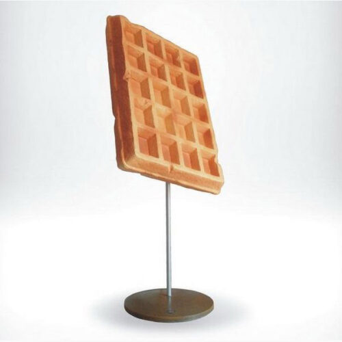 Waffle displayed on a metal stand.