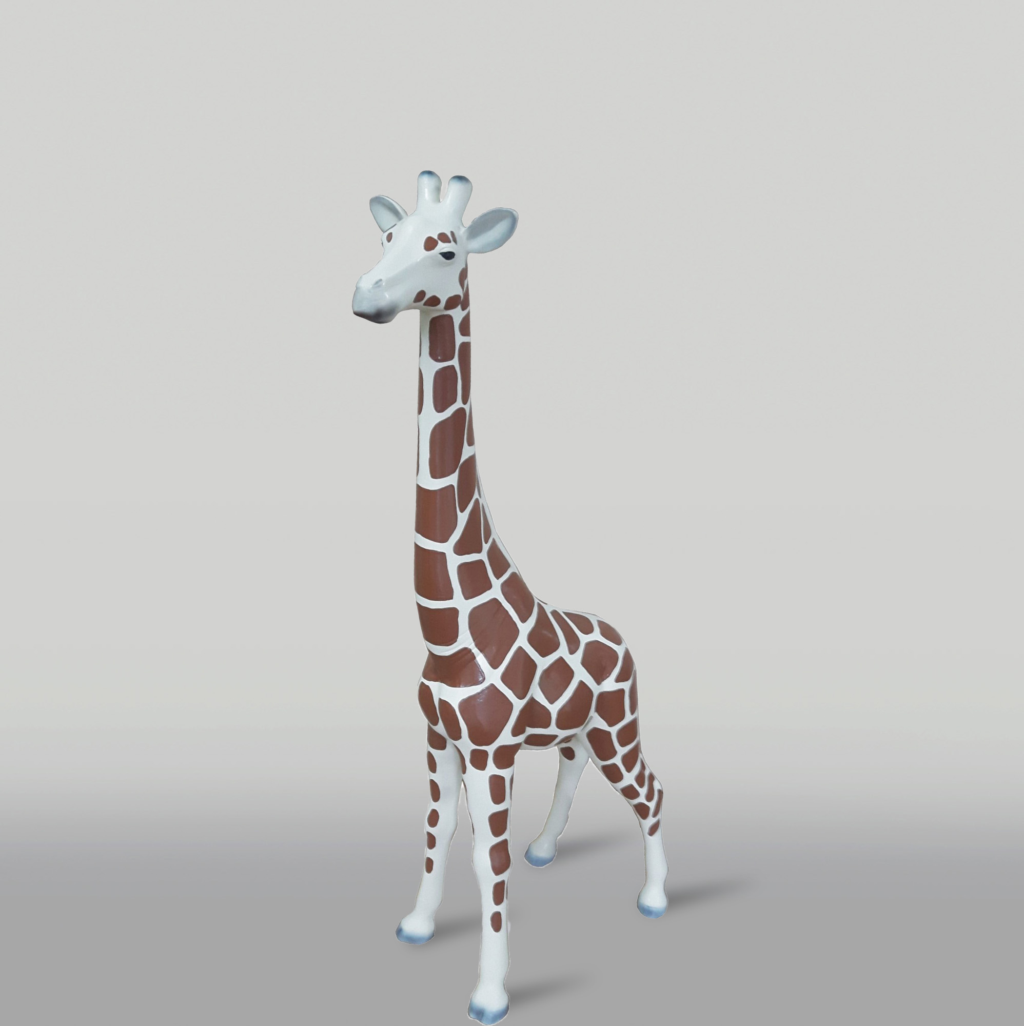 Resin handmade giraffe sculpture h-100cm 1 Toy giraffe figurine with brown and white spotted pattern against a plain background.