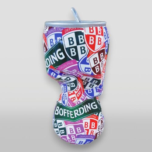 A crushed Bofferding beer can with a colorful and patterned design featuring multiple 