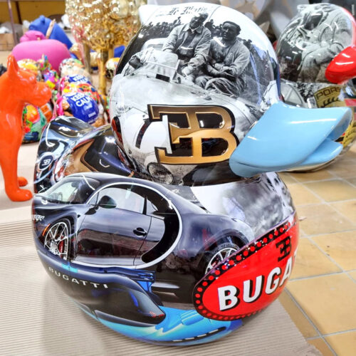 Rubber duck sculpture decorated with images of Bugatti cars and logos.