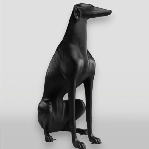 Sleek black greyhound statue sitting upright.