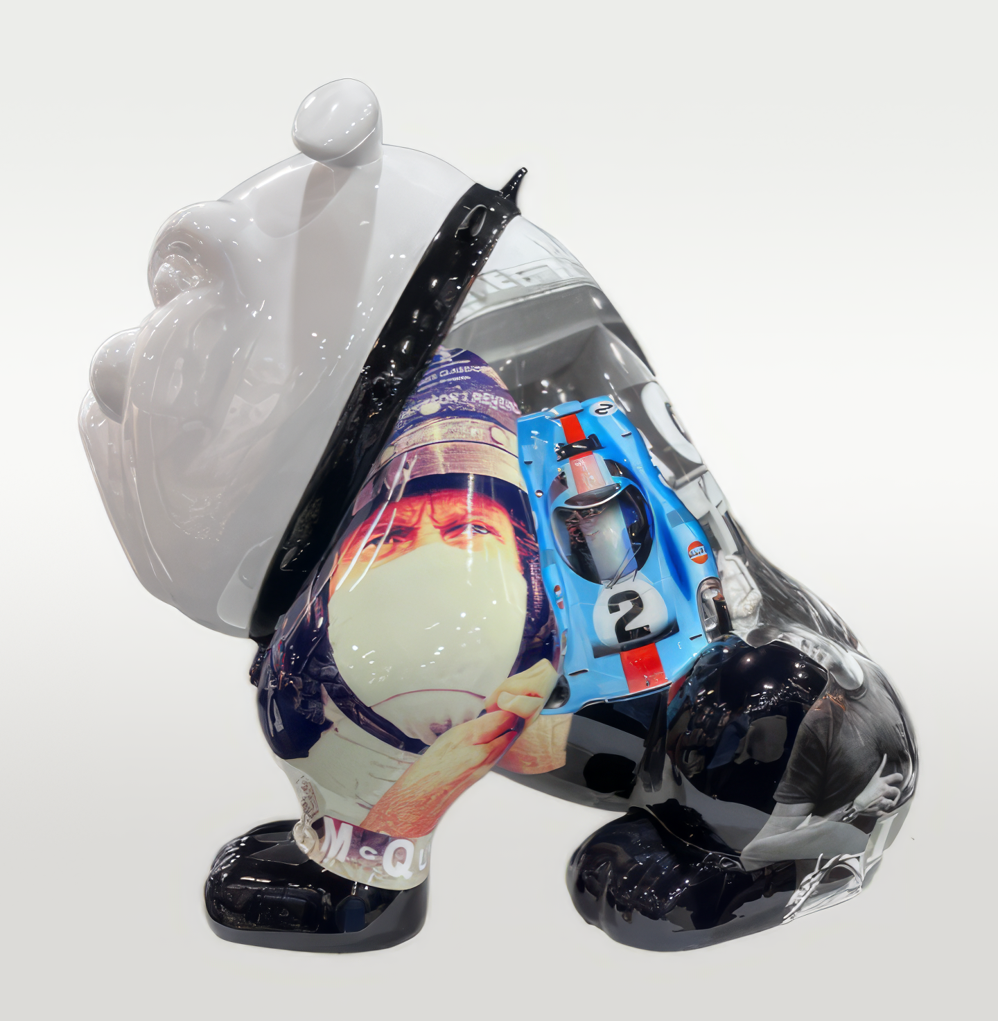 Bulldog Avella 55cm dog - McQueen 1 Bulldog sculpture with a glossy finish, painted with a collage featuring a race car driver in a helmet and a blue race car.