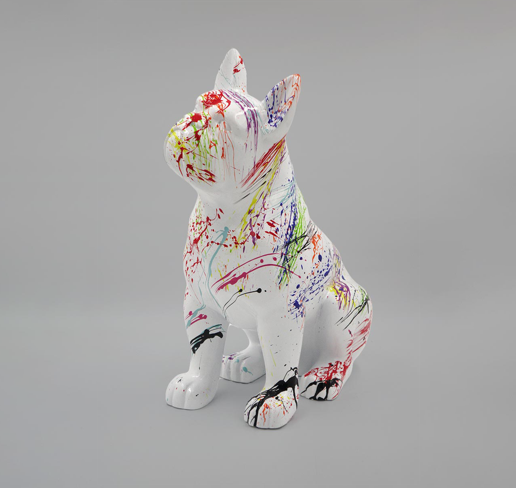 Boston Bulldog M - splash 1 Statue of a French Bulldog covered in multicolored paint splatters.