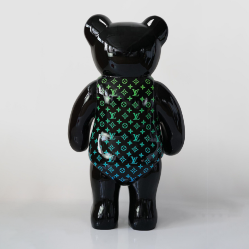 Black bear-shaped figurine with multicolored Louis Vuitton monogram pattern.