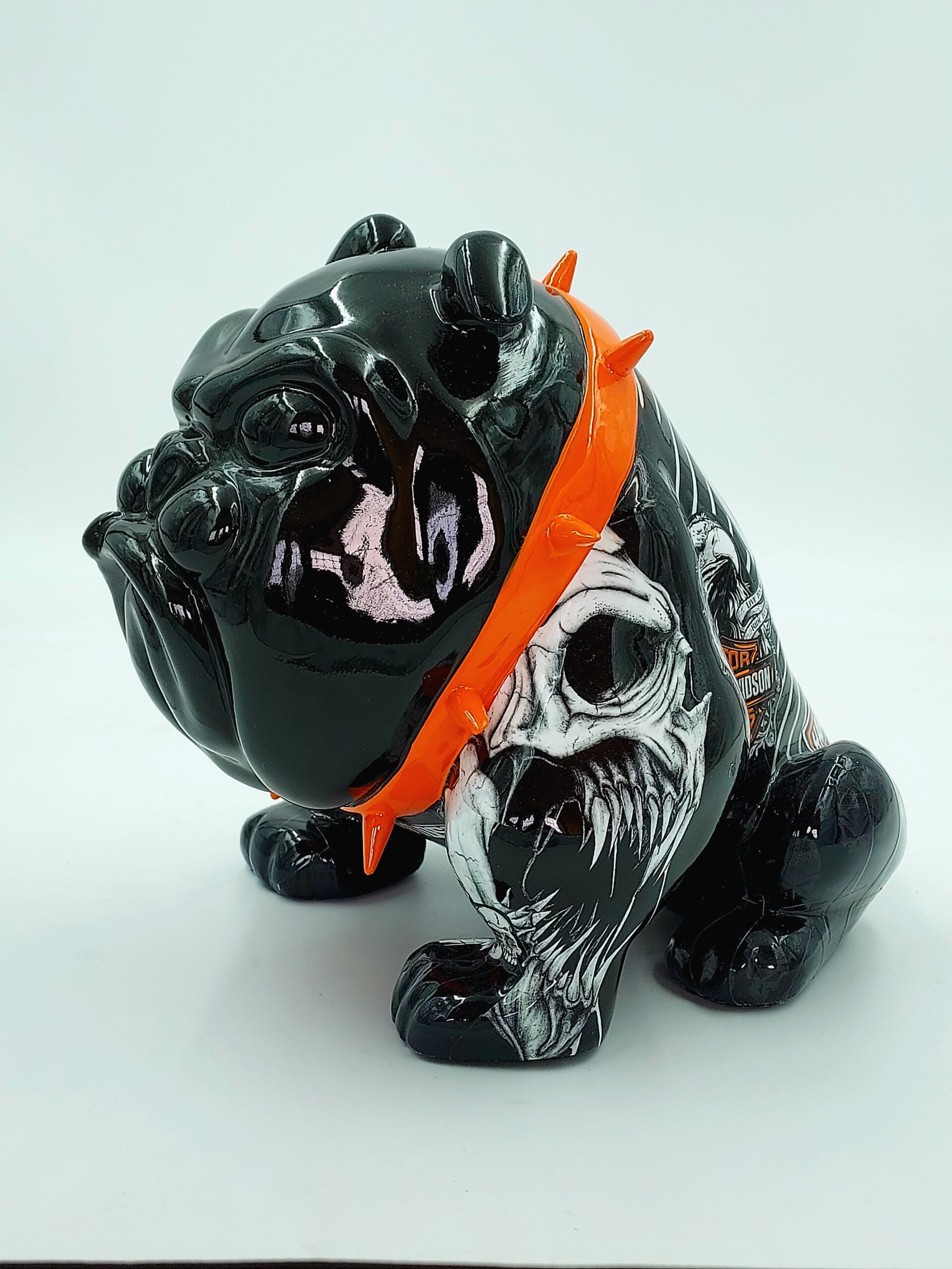 Bulldog Avella 55cm dog - Harley Davidson 1 Black bulldog figurine with orange studded collar, featuring painted skull and Harley-Davidson logo.