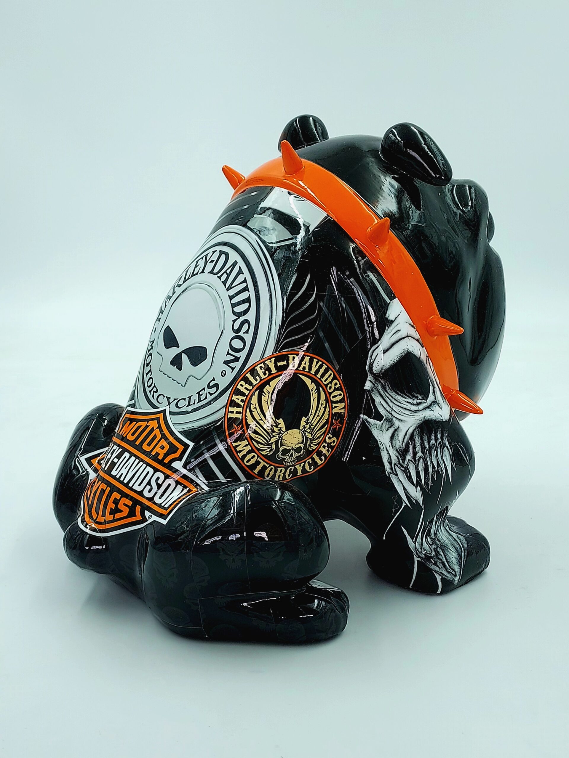 Bulldog Avella 55cm dog - Harley Davidson 3 Ceramic frog figurine featuring Harley-Davidson logos and intricate skull designs, with an orange collar adorned with spikes.