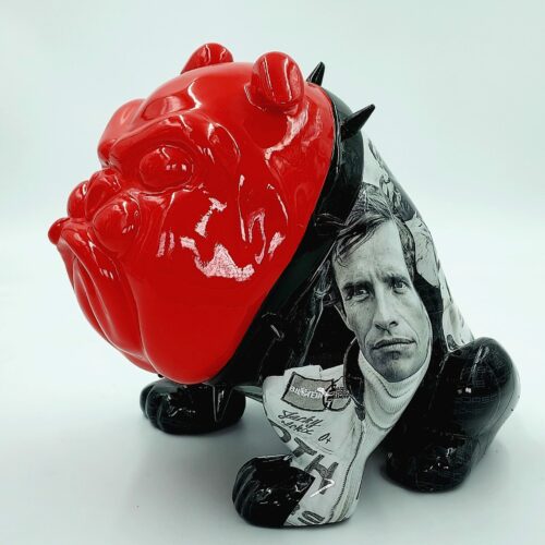 Bulldog sculpture with a glossy red head, black legs, and a torso featuring a black-and-white portrait of a man.