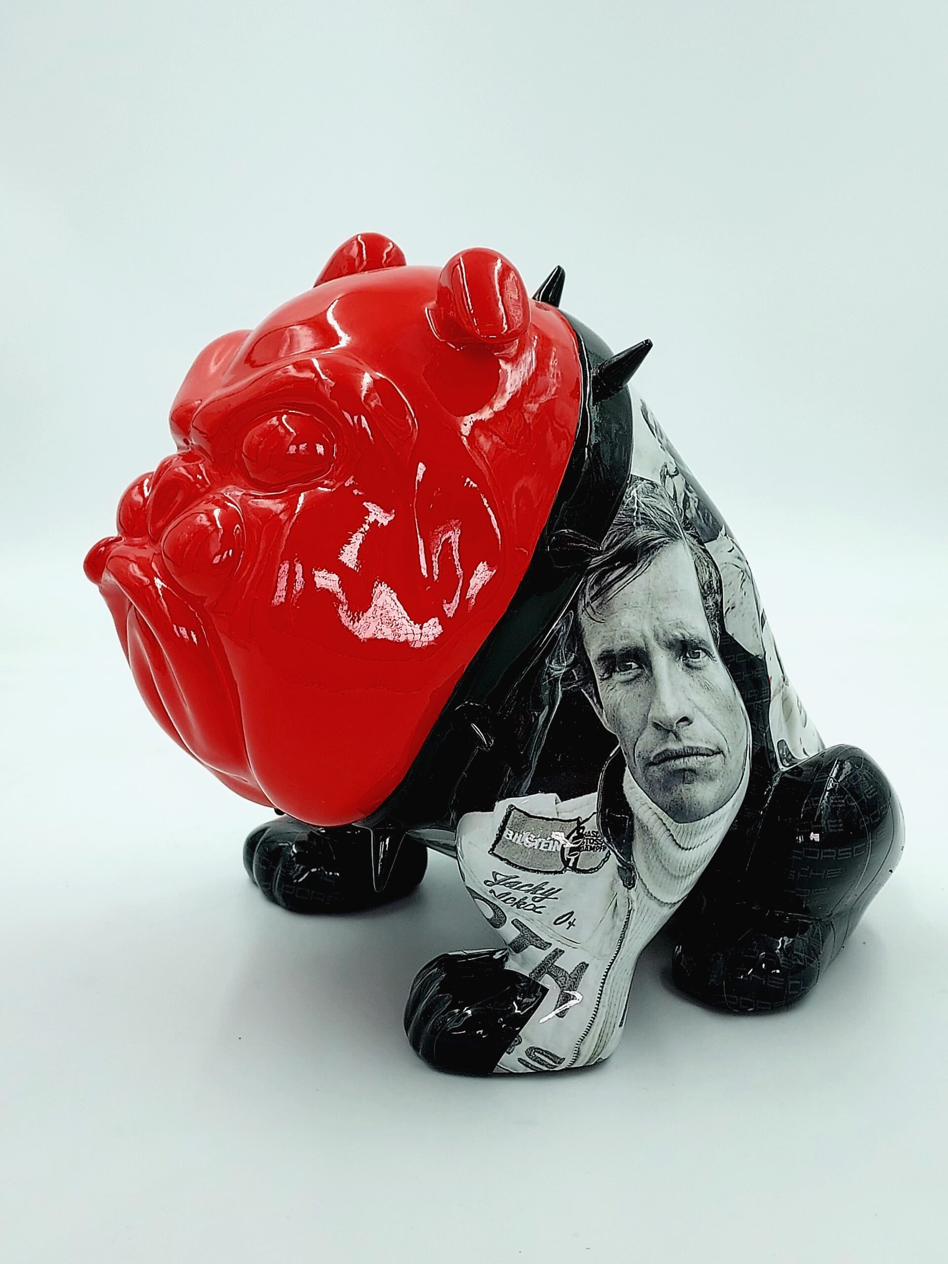 Bulldog Avella 55cm dog - Porsche 1 Bulldog sculpture with a glossy red head, black legs, and a torso featuring a black-and-white portrait of a man.