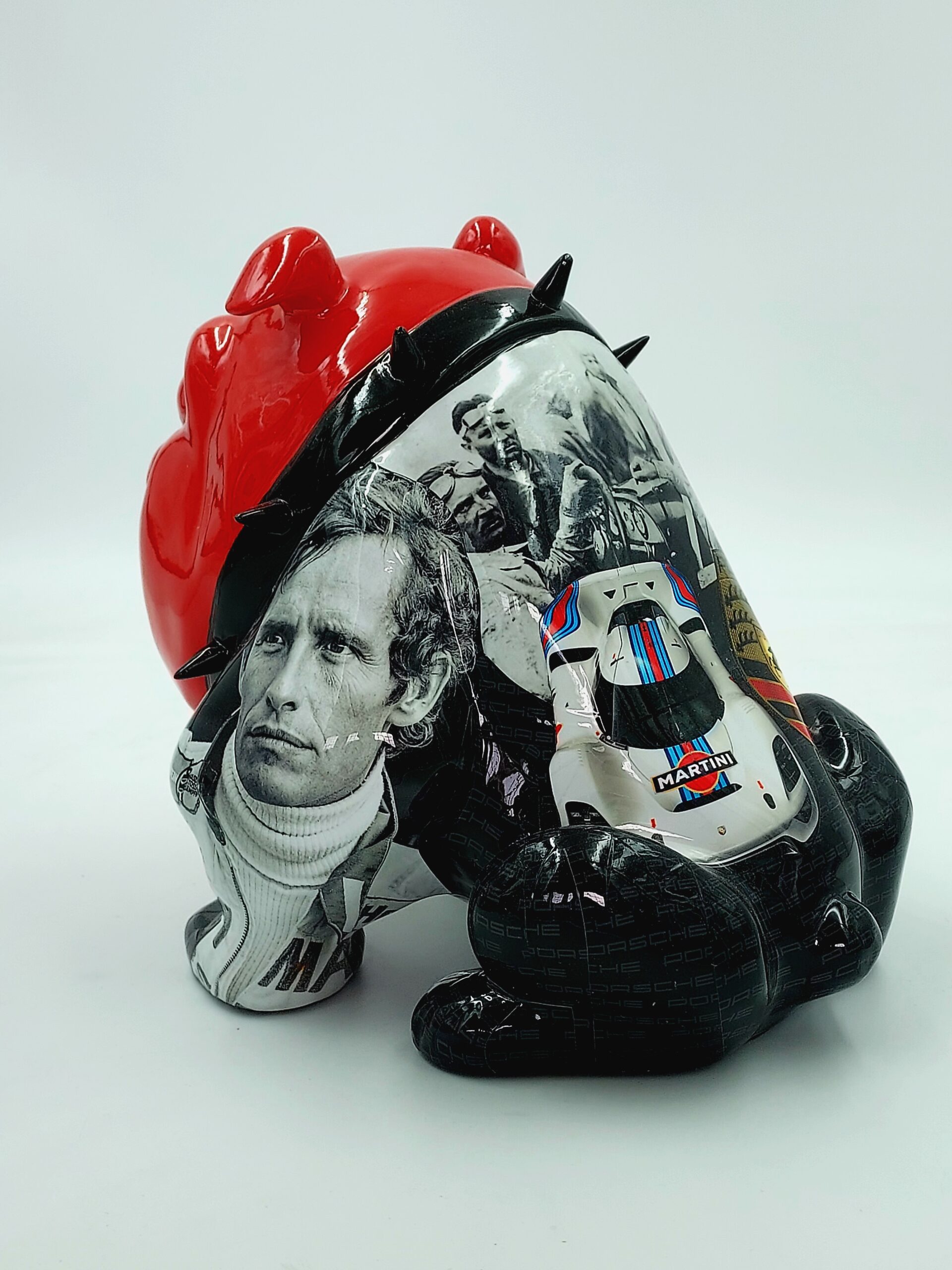 Bulldog Avella 55cm dog - Porsche 2 Red and black figurine with spiked details, featuring black and white photographs of a man and a racing car.