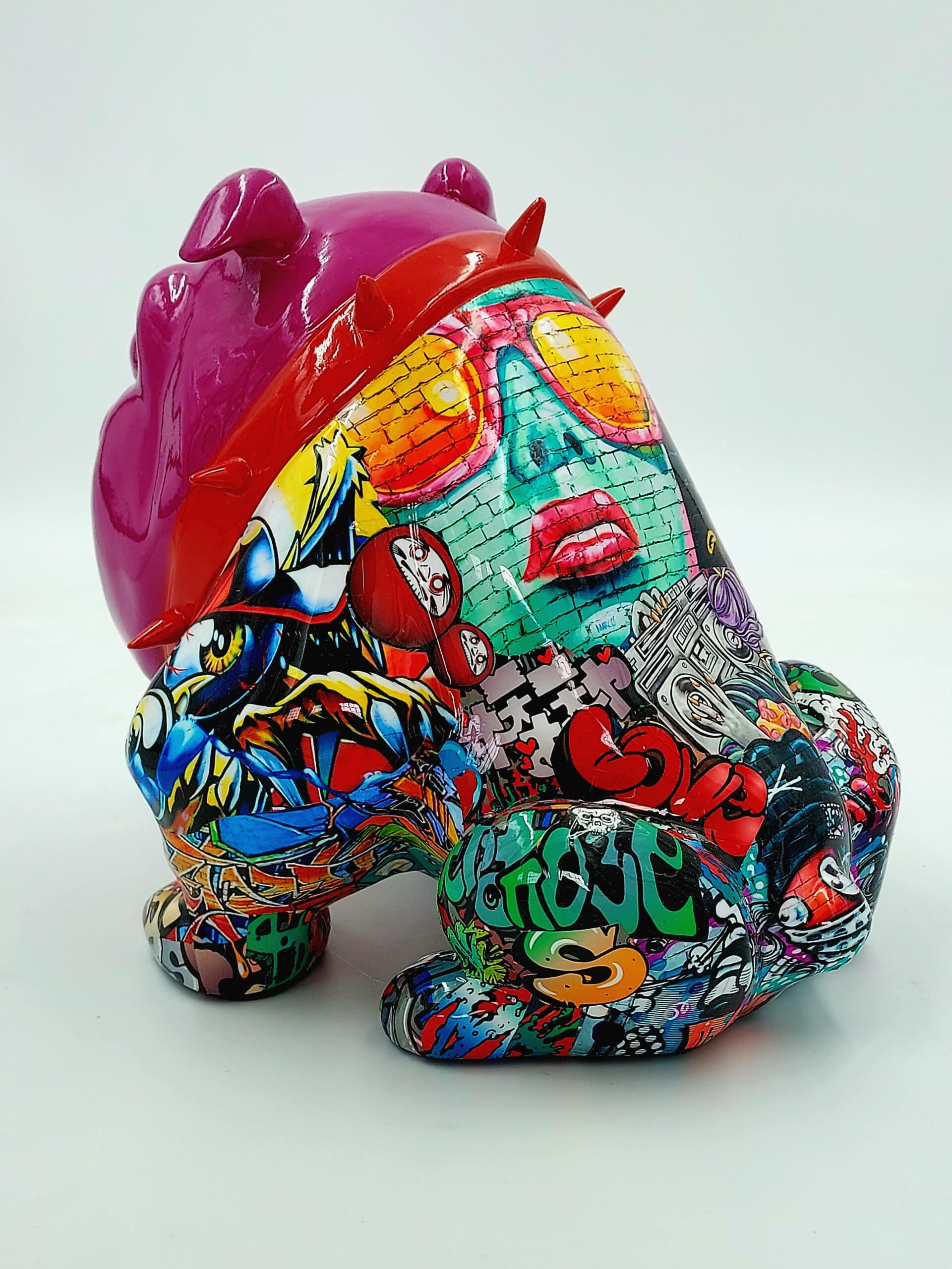 Bulldog Avella Dog 55cm - graffiti 2 Colorful graffiti-style sculpted figure with a horned helmet and vibrant street art designs, including abstract patterns and faces, covering its entire body.