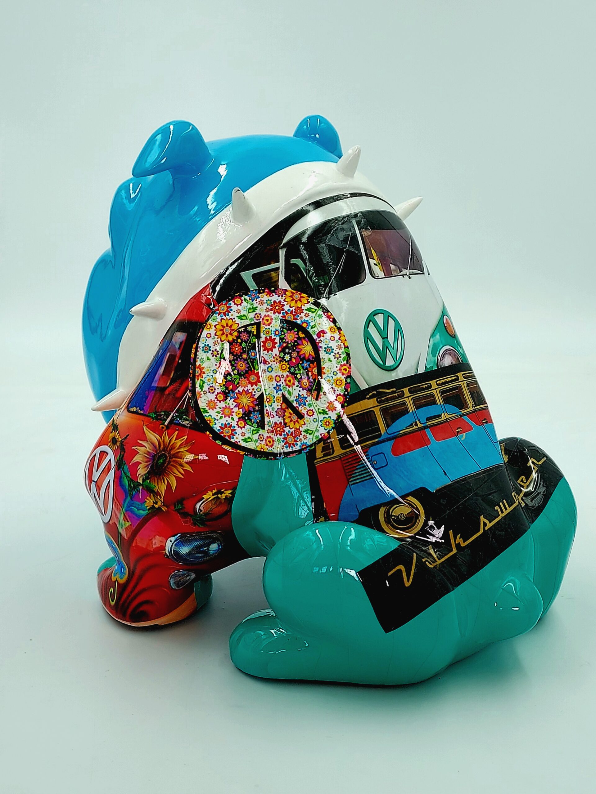 Bulldog Avella 55cm dog - Volkswagen 2 Colorful sculpture of a cartoonish bear with a design featuring a retro Volkswagen van and a floral peace sign.