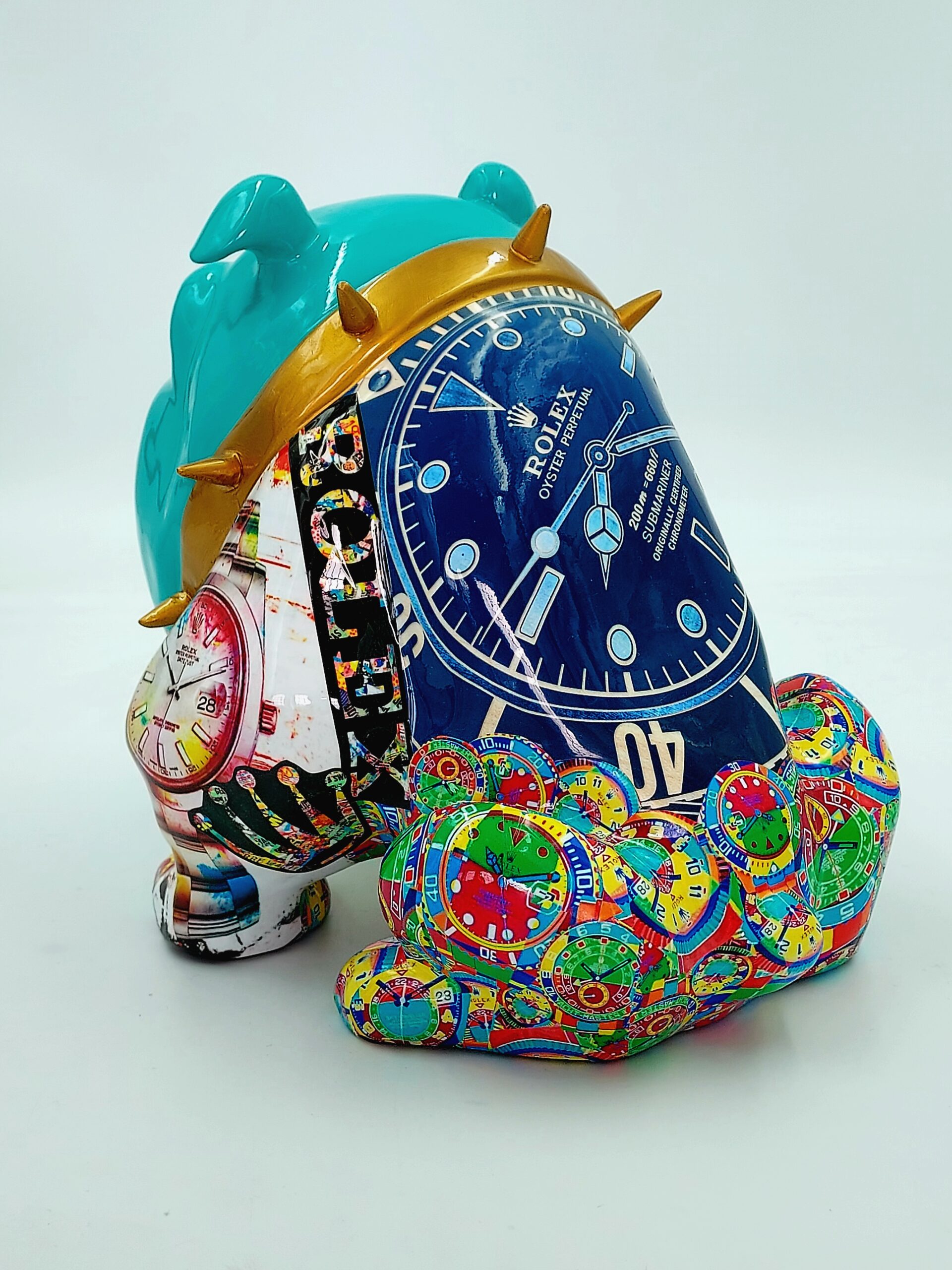 Bulldog Avella 55cm dog - Rolex 2 A colorful sculpture of a dog adorned with various watch designs and motifs, including a prominent blue Rolex watch face with a gold spiked collar.