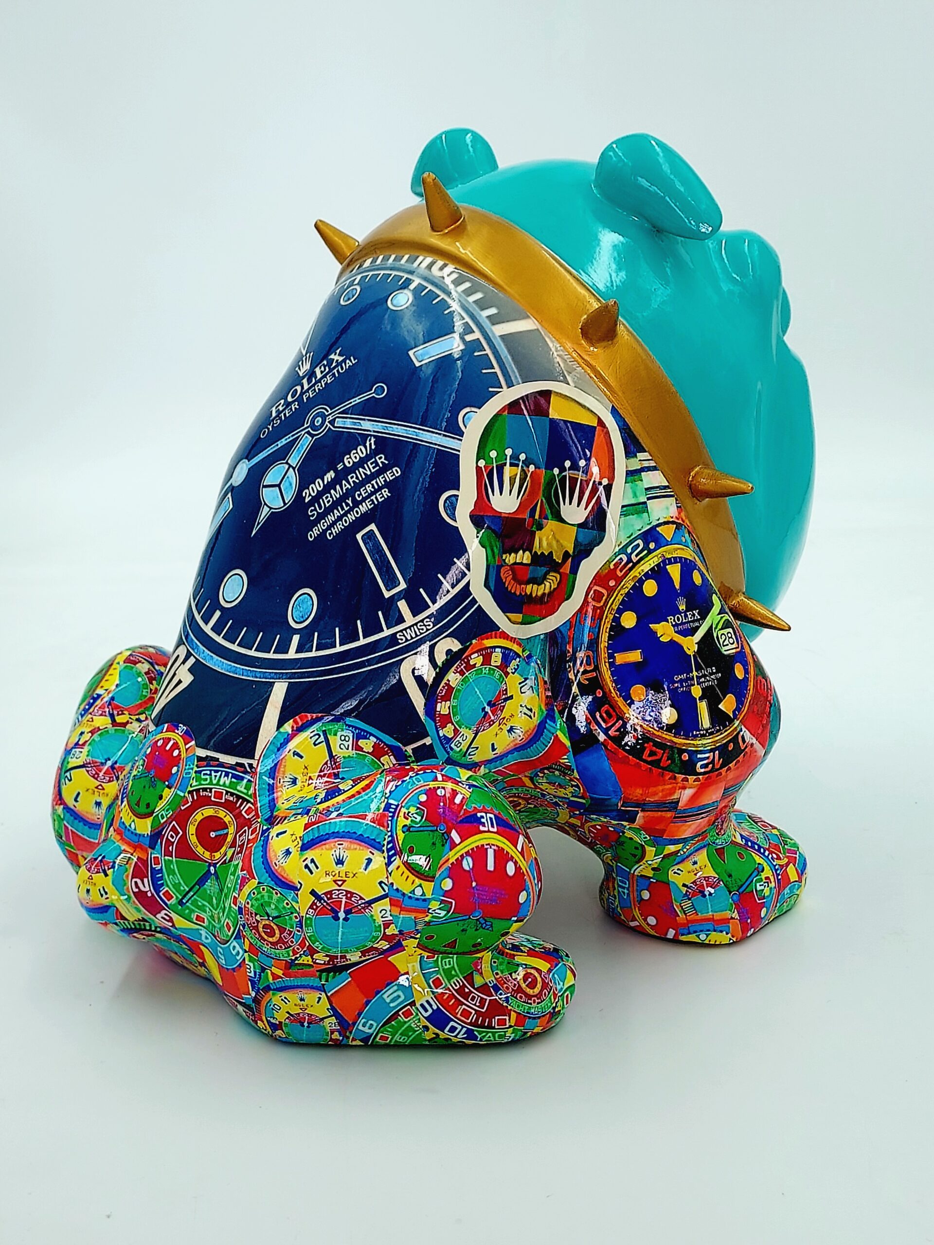 Bulldog Avella 55cm dog - Rolex 3 Colorful sculpture of a sitting dog with a blue and gold spiked collar, decorated with vibrant watch faces, a skull graphic, and