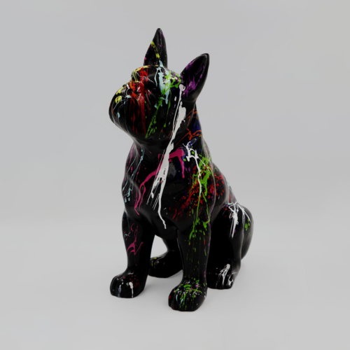 Black dog sculpture with vibrant paint splashes in various colors on a gray background.