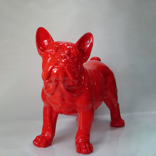 Bright red bulldog sculpture with a glossy finish against a plain background.
