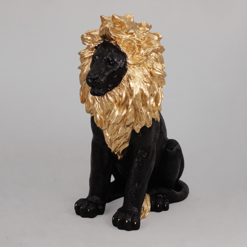 A statue of a seated lion with a black body and a golden mane.