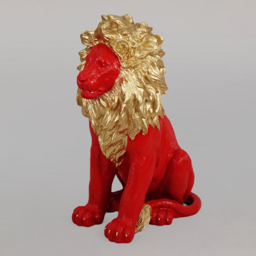 A red lion sculpture with a golden mane.