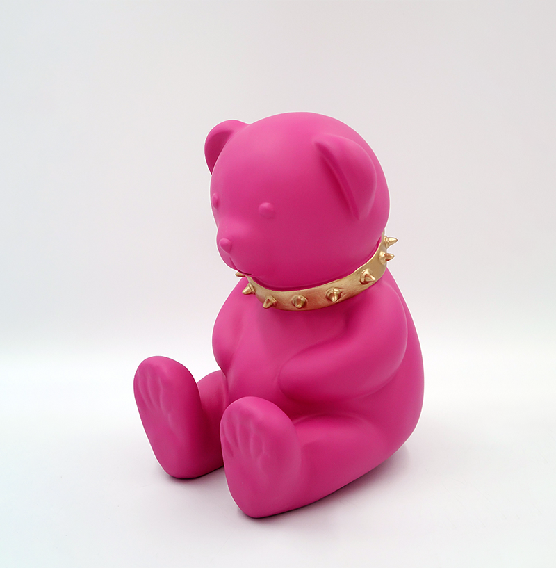 Bear H-31 cm - pink matte 1 Pink teddy bear statue wearing a gold spiked collar.