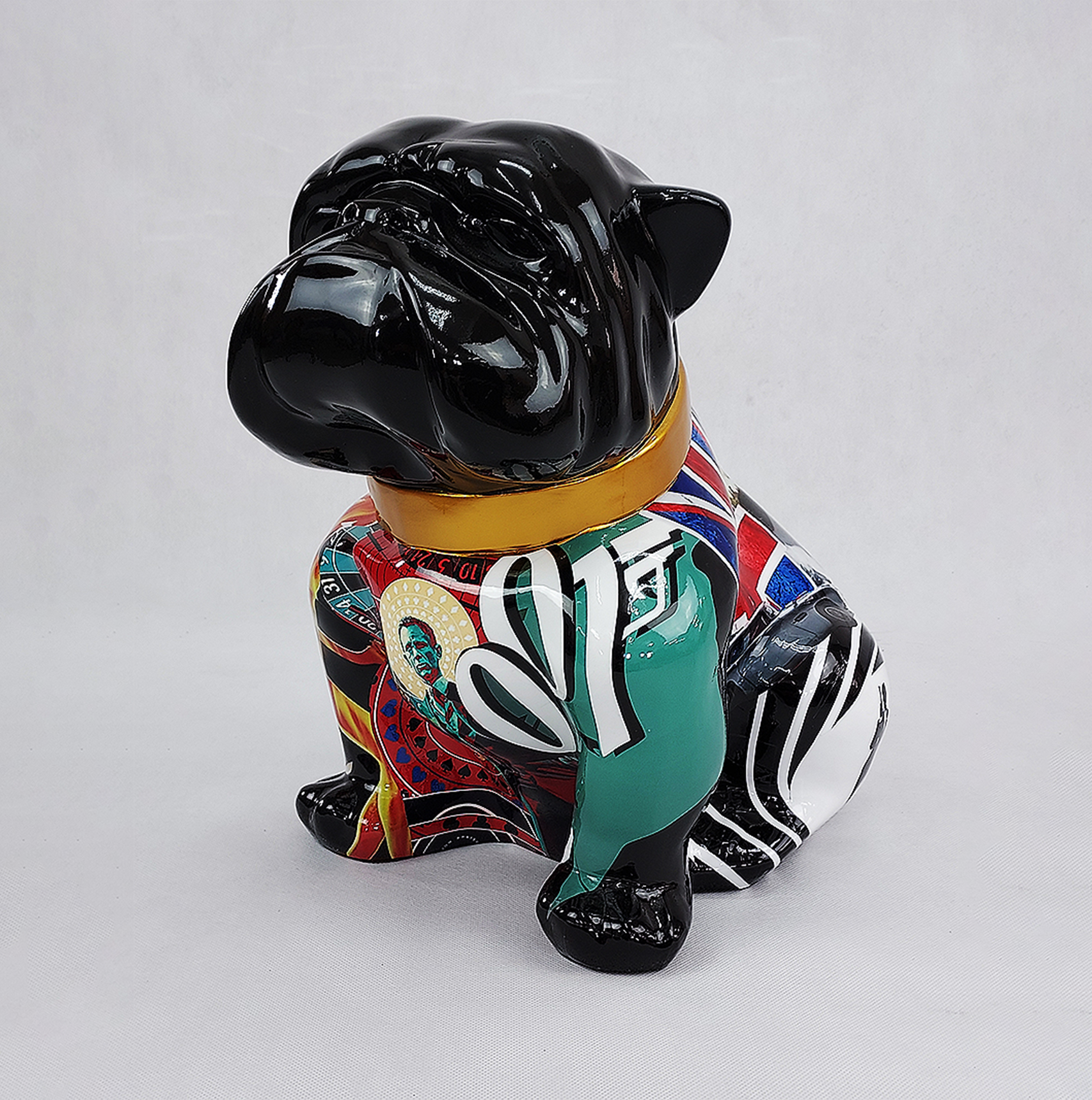 Bulldog Angelo 40cm dog - James Bond 1 A sculpture of a bulldog with a black head and colorful, patterned body, including elements like green, red, and Union Jack designs.