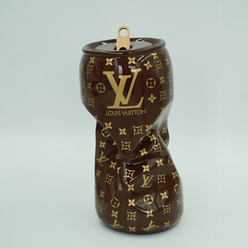 Crushed can with Louis Vuitton monogram pattern and logo against a plain background.