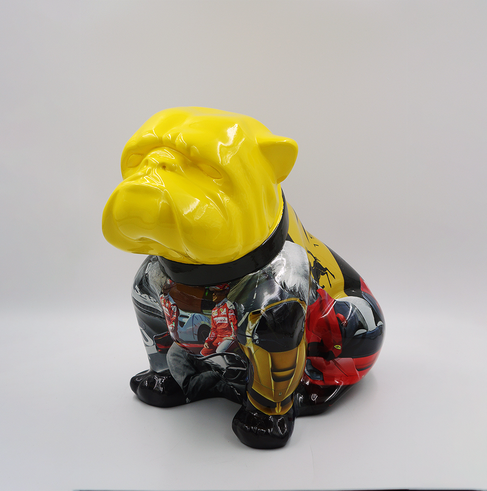 Bulldog Angelo 40cm dog - Ferrari 1 Colorful bulldog sculpture with a yellow head and multicolored body, featuring various designs and patterns.