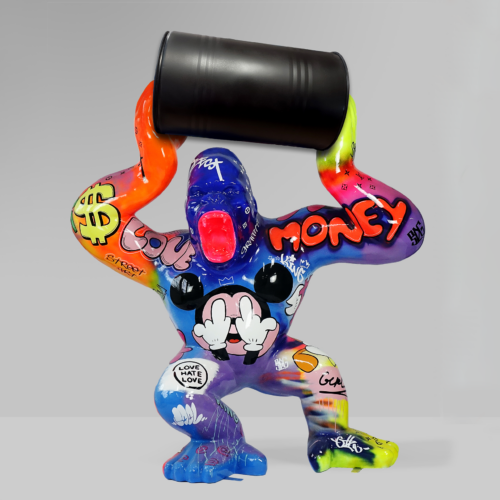 Colorful graffiti-covered gorilla statue holding a black barrel overhead.