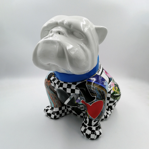 Ceramic bulldog statue with a glossy white head and a colorful, collage-style body featuring various patterns and illustrations.
