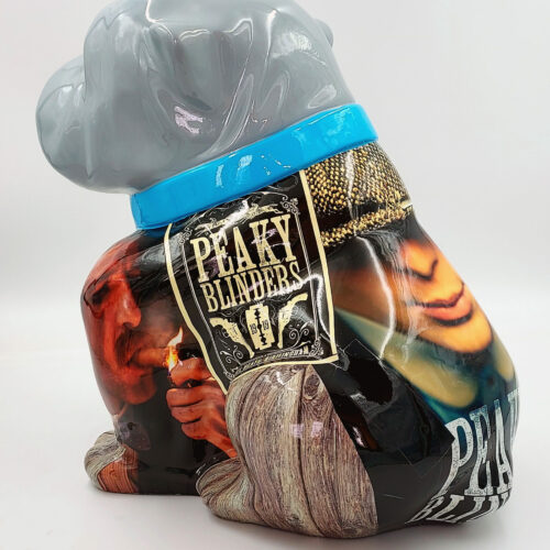 Gray dog sculpture with a blue collar, featuring a painted design inspired by the TV show 