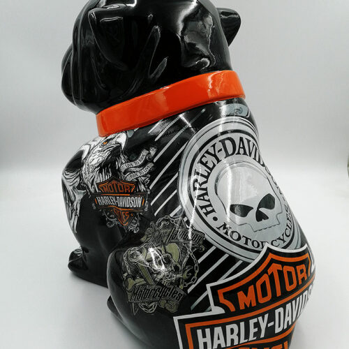 Black ceramic bulldog with Harley-Davidson stickers, featuring an orange collar.