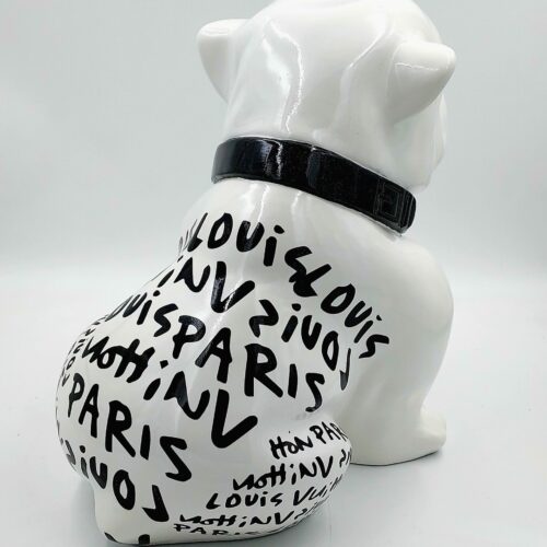 White bulldog sculpture with black text reading 