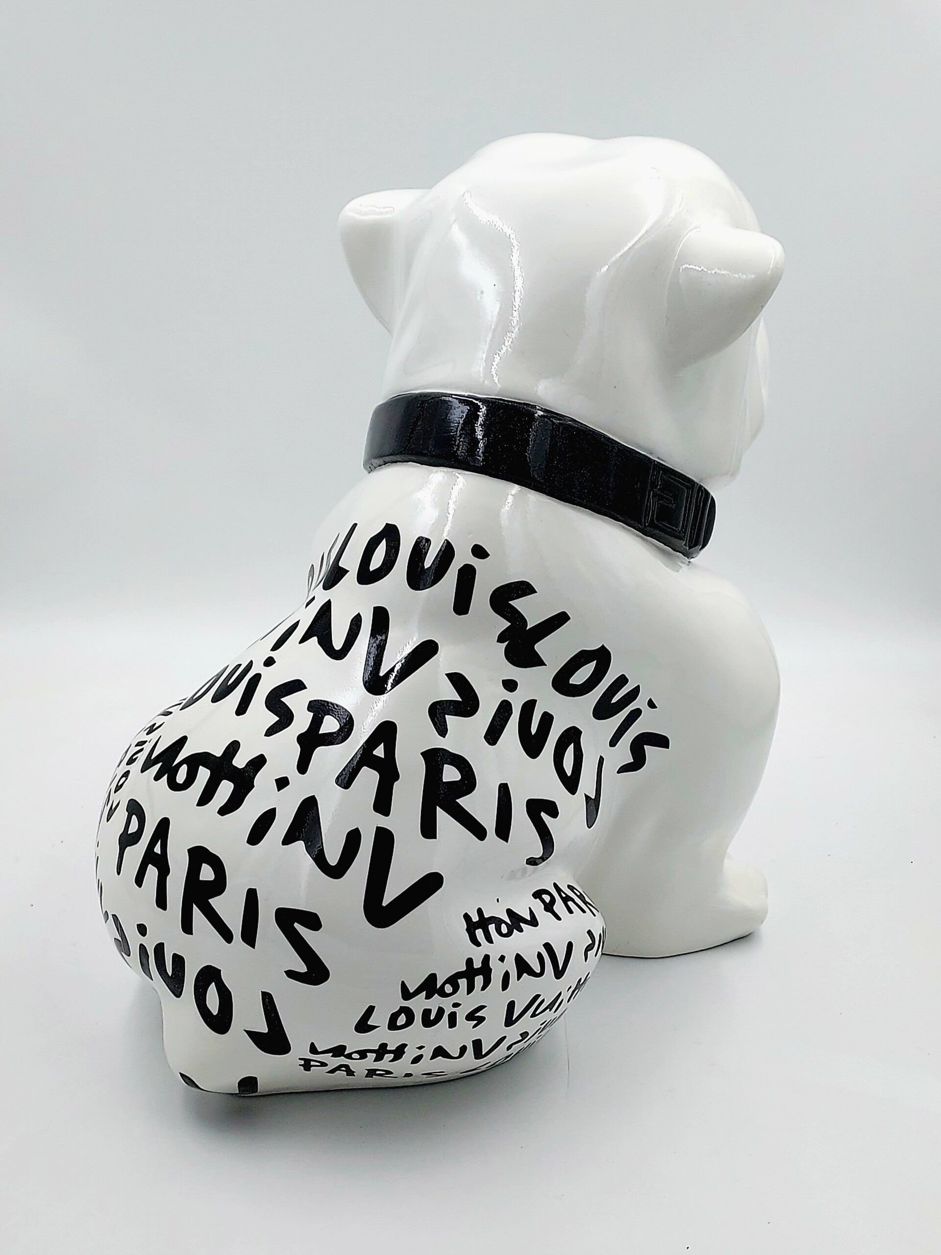 Bulldog Angelo 40cm dog - Louis Paris 2 White bulldog sculpture with black text reading