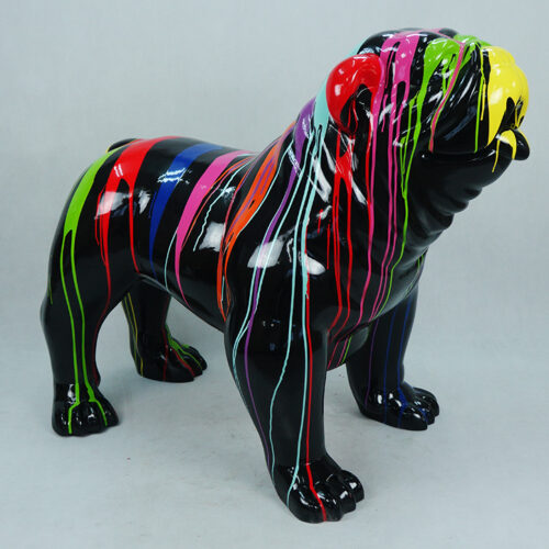 Sculpture of a bulldog painted glossy black with colorful paint streaks in green, yellow, red, blue, pink, and orange dripping over it.