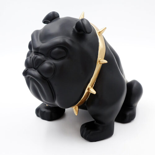 Black bulldog figurine wearing a gold spiked collar.