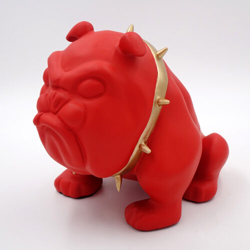 Red bulldog figurine with a gold spiked collar