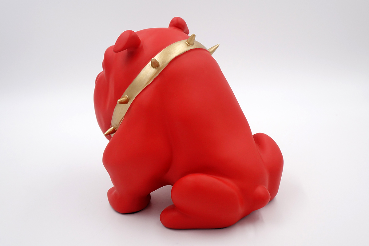 Bulldog Avella 55cm dog - red mat 2 Red bulldog figurine with a gold spiked collar sitting on a white background.