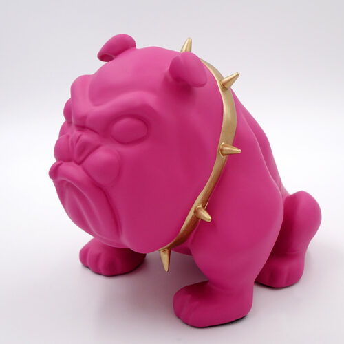 Pink bulldog sculpture with a gold spiked collar.