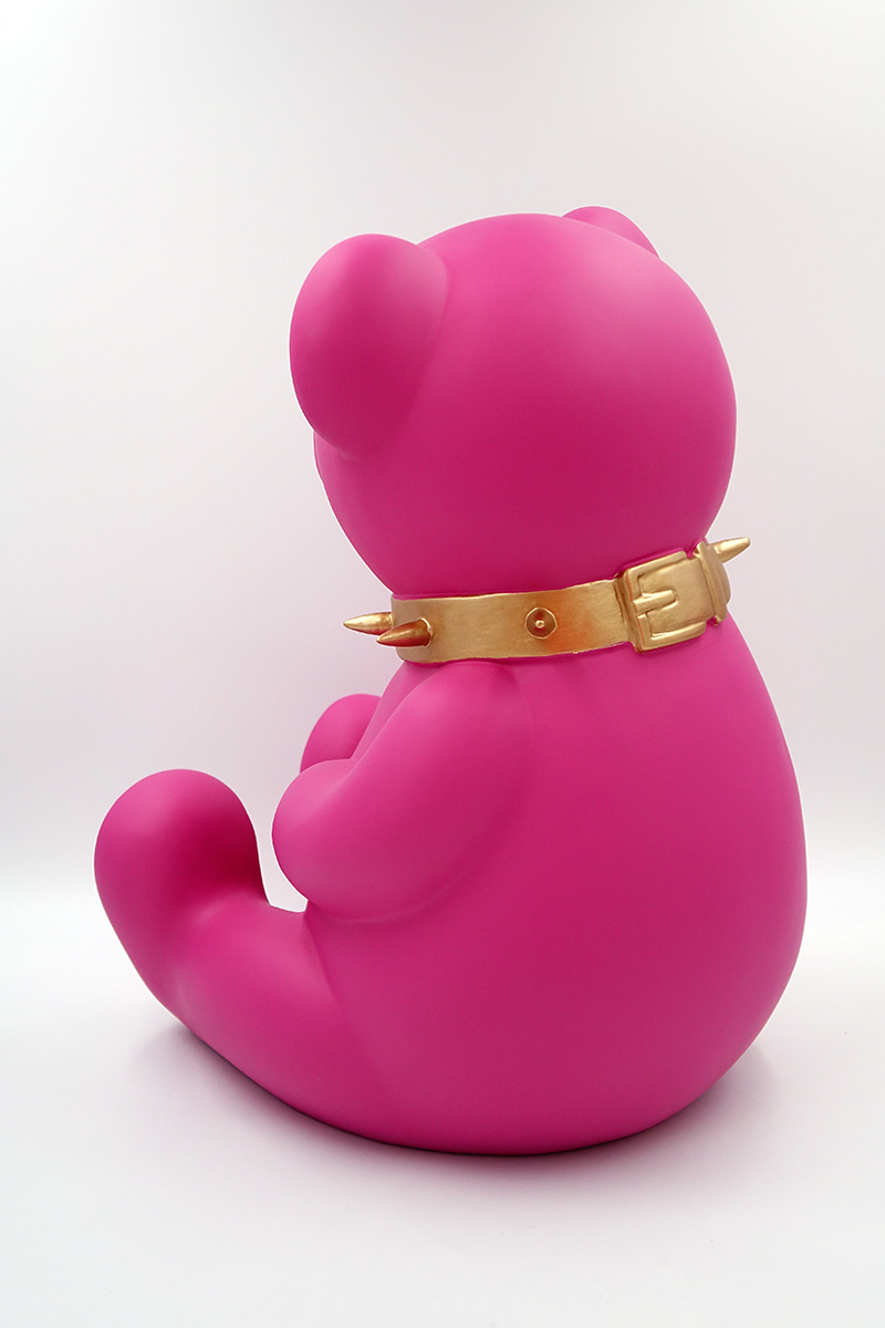 Bear H-45 cm - pink matte 2 Pink bear figurine with a golden spiked collar sitting against a white background.