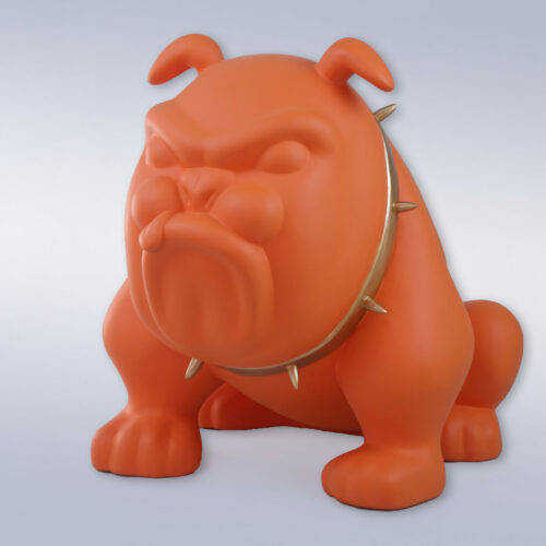 Orange bulldog statue wearing a spiked collar against a plain background.
