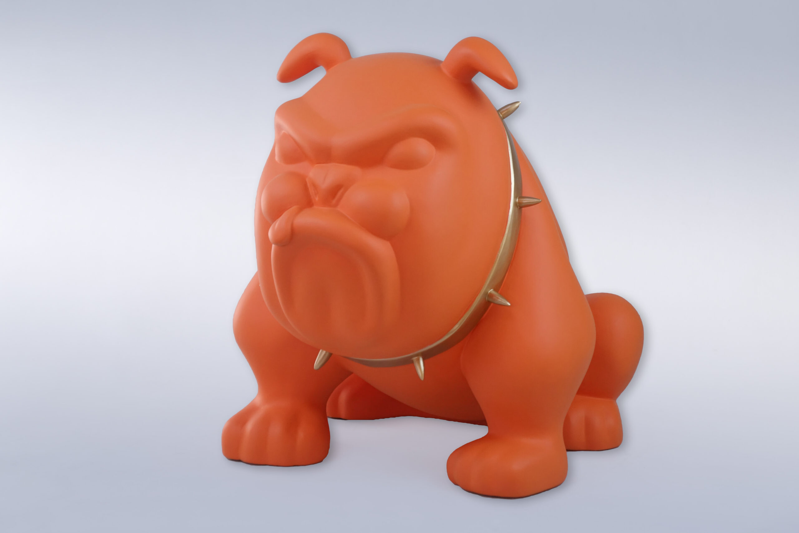 Dog Bulldog Avella 55cm - Matte Orange 1 Orange bulldog statue wearing a spiked collar against a plain background.