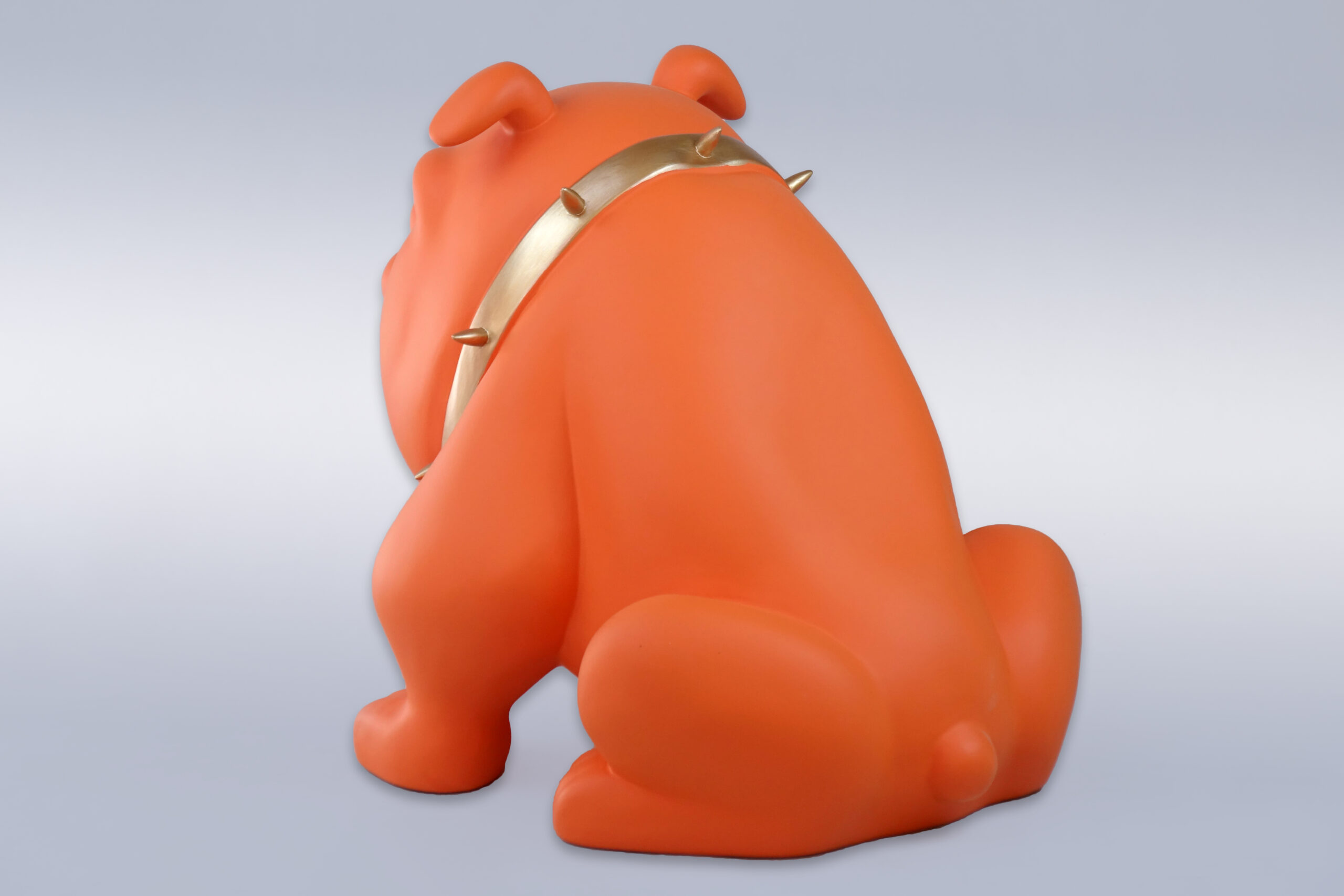 Dog Bulldog Avella 55cm - Matte Orange 2 Orange bulldog sculpture with a gold spiked collar, facing away against a neutral background.