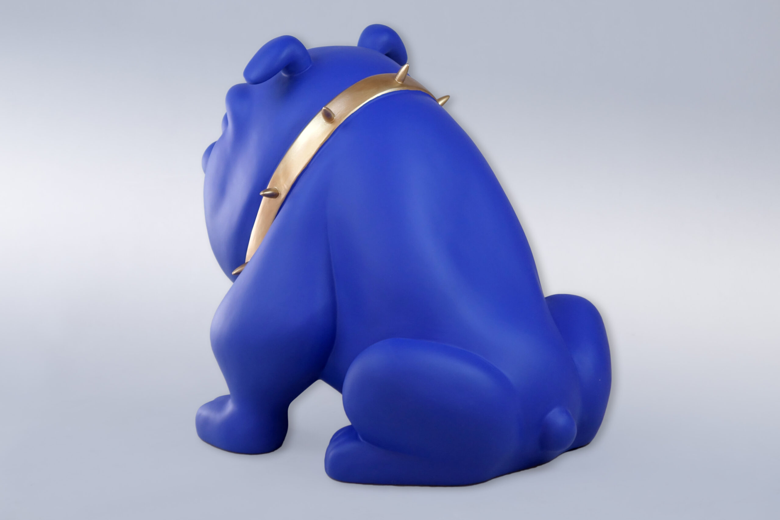 Dog Bulldog Avella 55cm - Matte Blue 2 Blue bulldog sculpture with a gold spiked collar, seen from behind.
